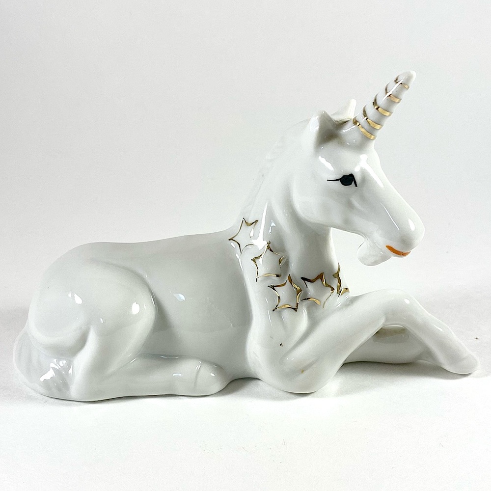 White and gold ceramic unicorn figurine